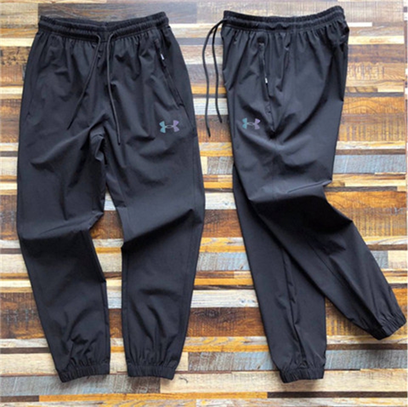Under Armour men's summer splicing casual ice silk quick-drying pants! 3D cut tapered version of the slightly closed sports trousers!